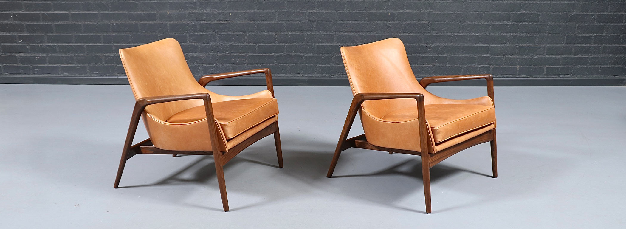 Danish Modern Leather Sculpted Lounge Chairs by Ib Kofod-Larsen Image